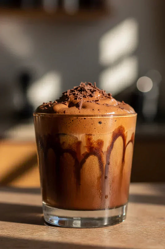Chocolate Indulgence cold brew with chocolate cold foam and cocoa powder garnish